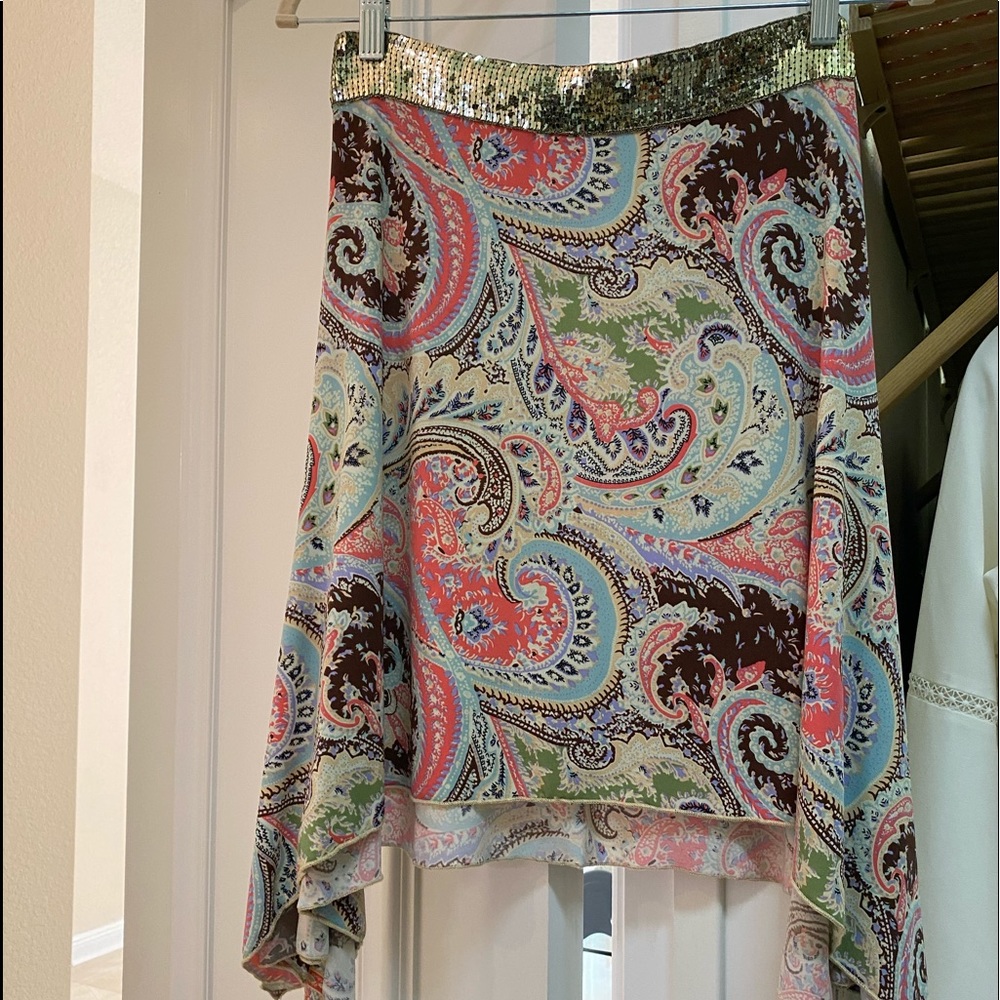Asymmetrical skirt with sequin waistband.